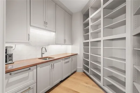 a bedroom with a bed and glass windows