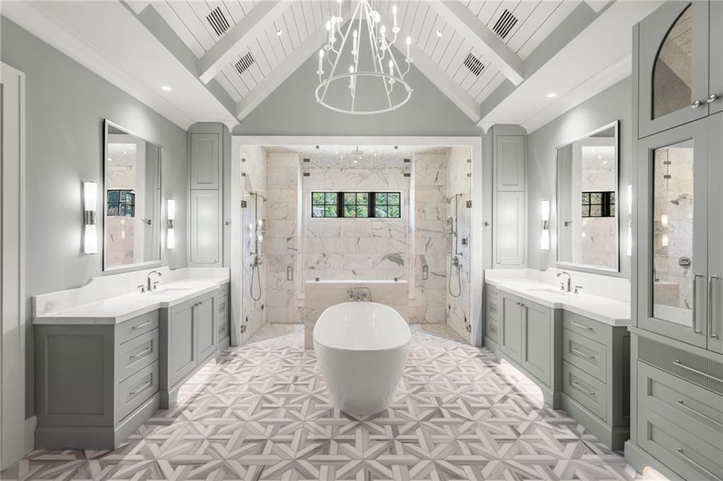 6091 GC Crow Road Flowery Branch, GA 30542 - Photo 27 of 100 a spacious bathroom with a granite countertop sink toilet and shower