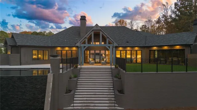 a front view of a house with a garden