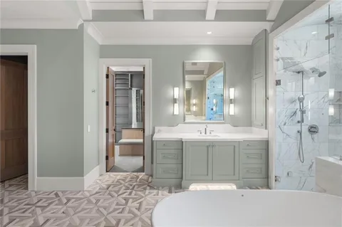 a view of a livingroom with wooden floor and stairs