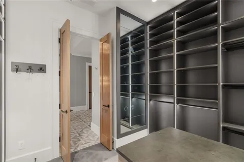 a room with a bed and cabinet