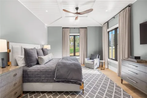 a view of a livingroom with a ceiling fan and window