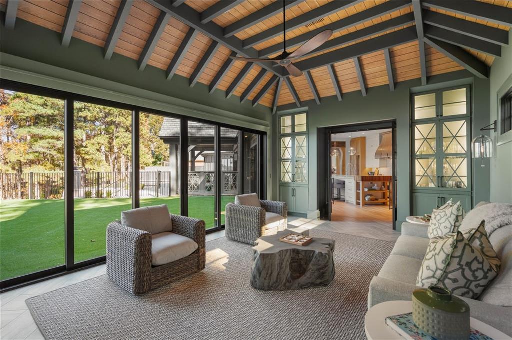 6091 GC Crow Road Flowery Branch, GA 30542 - Photo 42 of 100 a living room with furniture and a large window