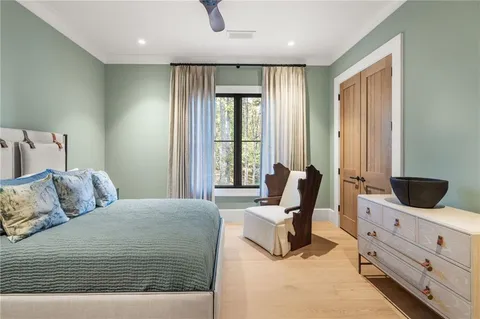 a view of swimming pool with outdoor seating and plants