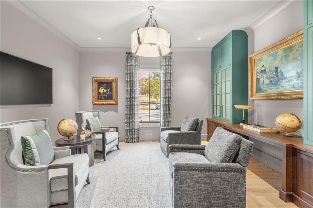 6091 GC Crow Road Flowery Branch, GA 30542 - Photo 49 of 100 a living room with furniture and a flat screen tv