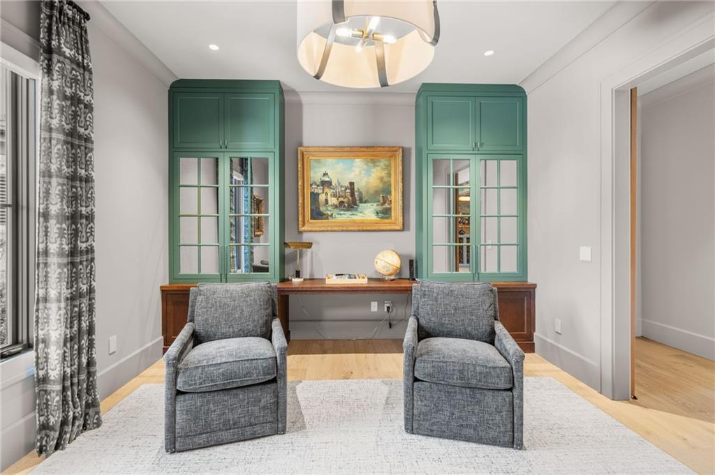 6091 GC Crow Road Flowery Branch, GA 30542 - Photo 50 of 100 a living room with furniture and a large window