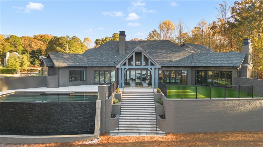 6091 GC Crow Road Flowery Branch, GA 30542 - Photo 7 of 100 a front view of a house with a garden