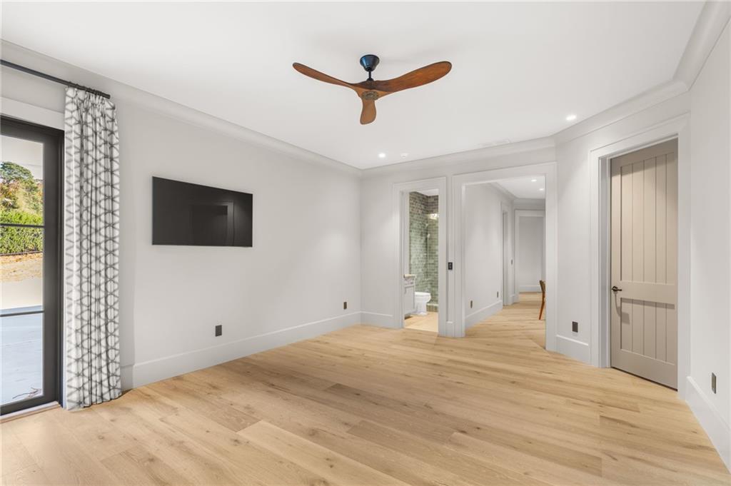 6091 GC Crow Road Flowery Branch, GA 30542 - Photo 73 of 100 a view of a livingroom with a ceiling fan and window
