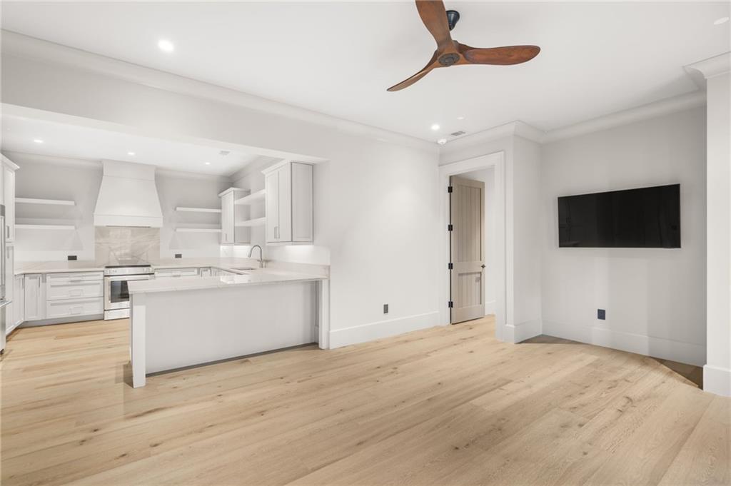 6091 GC Crow Road Flowery Branch, GA 30542 - Photo 75 of 100 a view of a kitchen with wooden floor and a sink