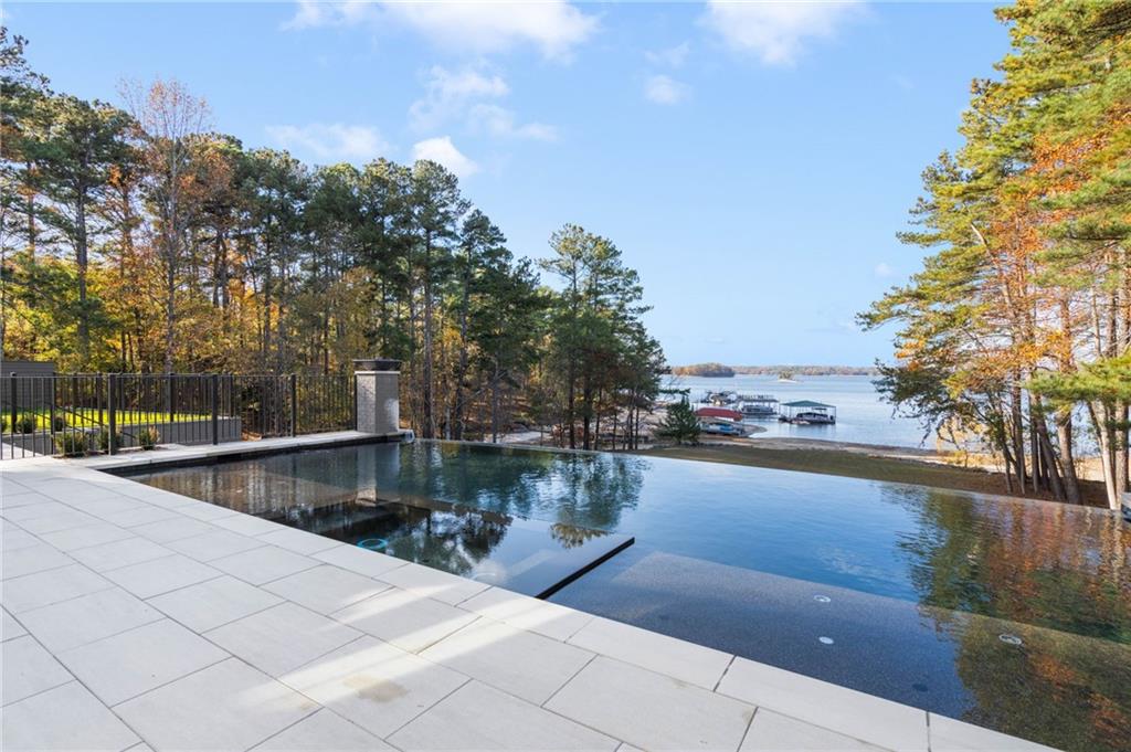 6091 GC Crow Road Flowery Branch, GA 30542 - Photo 88 of 100 a view of swimming pool with outdoor seating and plants