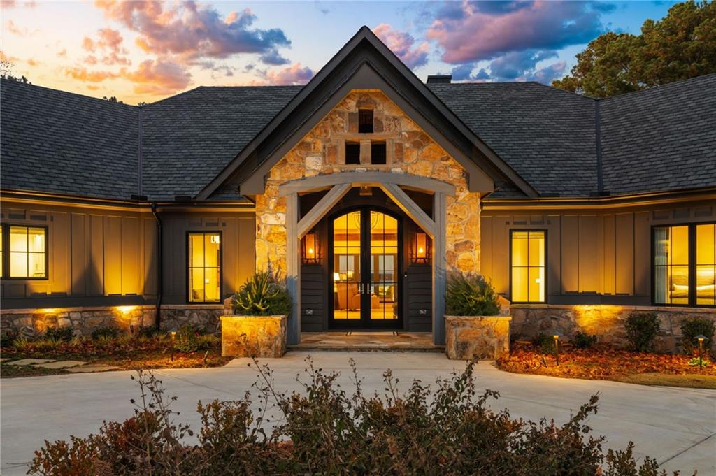 6091 GC Crow Road Flowery Branch, GA 30542 - Photo 10 of 100 a front view of a house with a yard