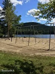 a view of lake with green space