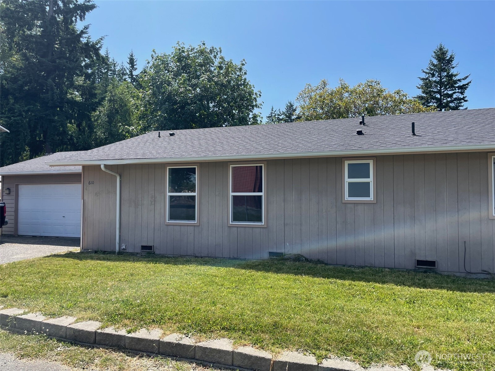 610 Rose Way Everett, WA 98203 - Photo 1 of 21 a view of a house with a backyard
