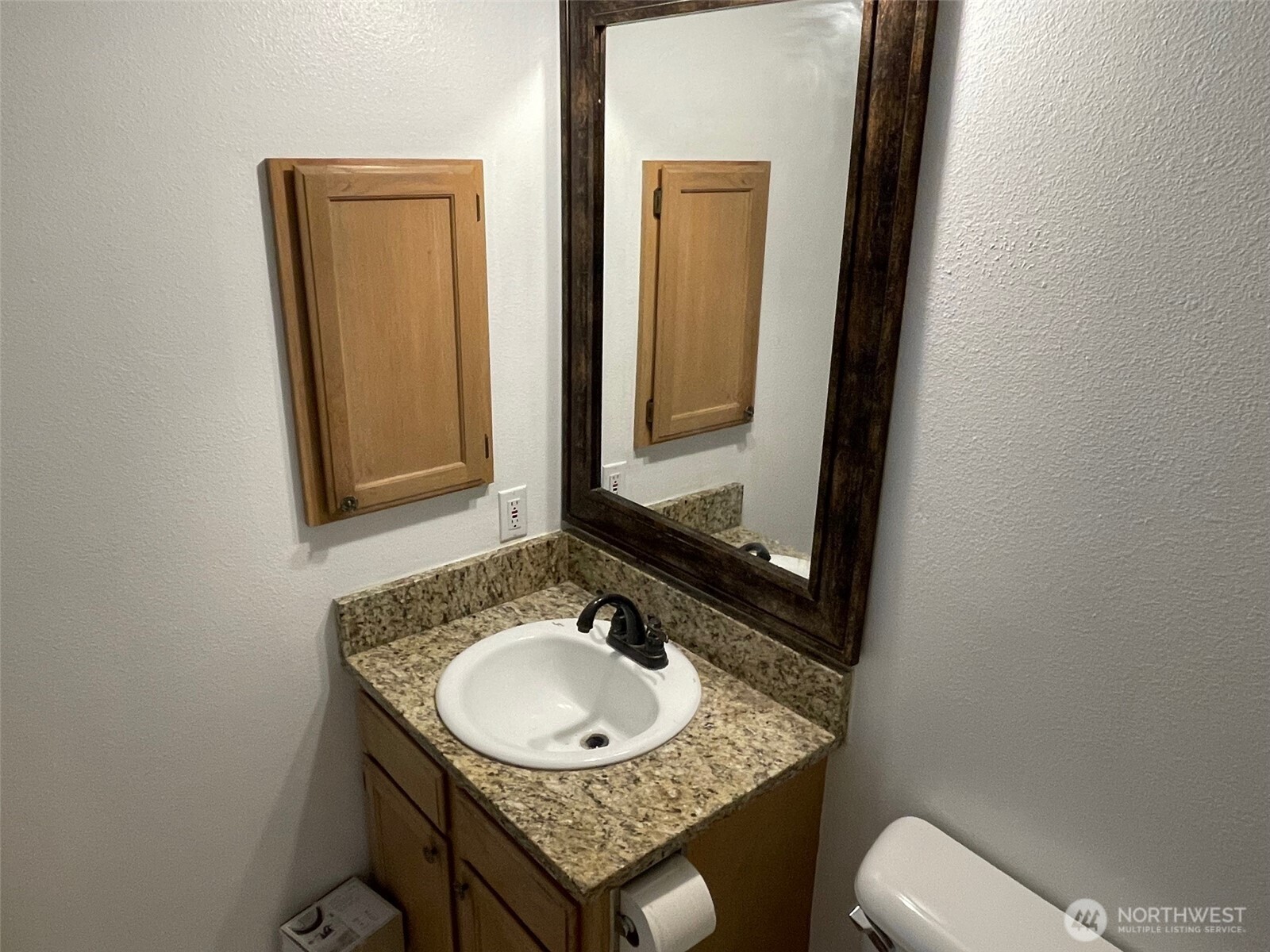 610 Rose Way Everett, WA 98203 - Photo 11 of 21 a bathroom with a granite countertop sink toilet and mirror