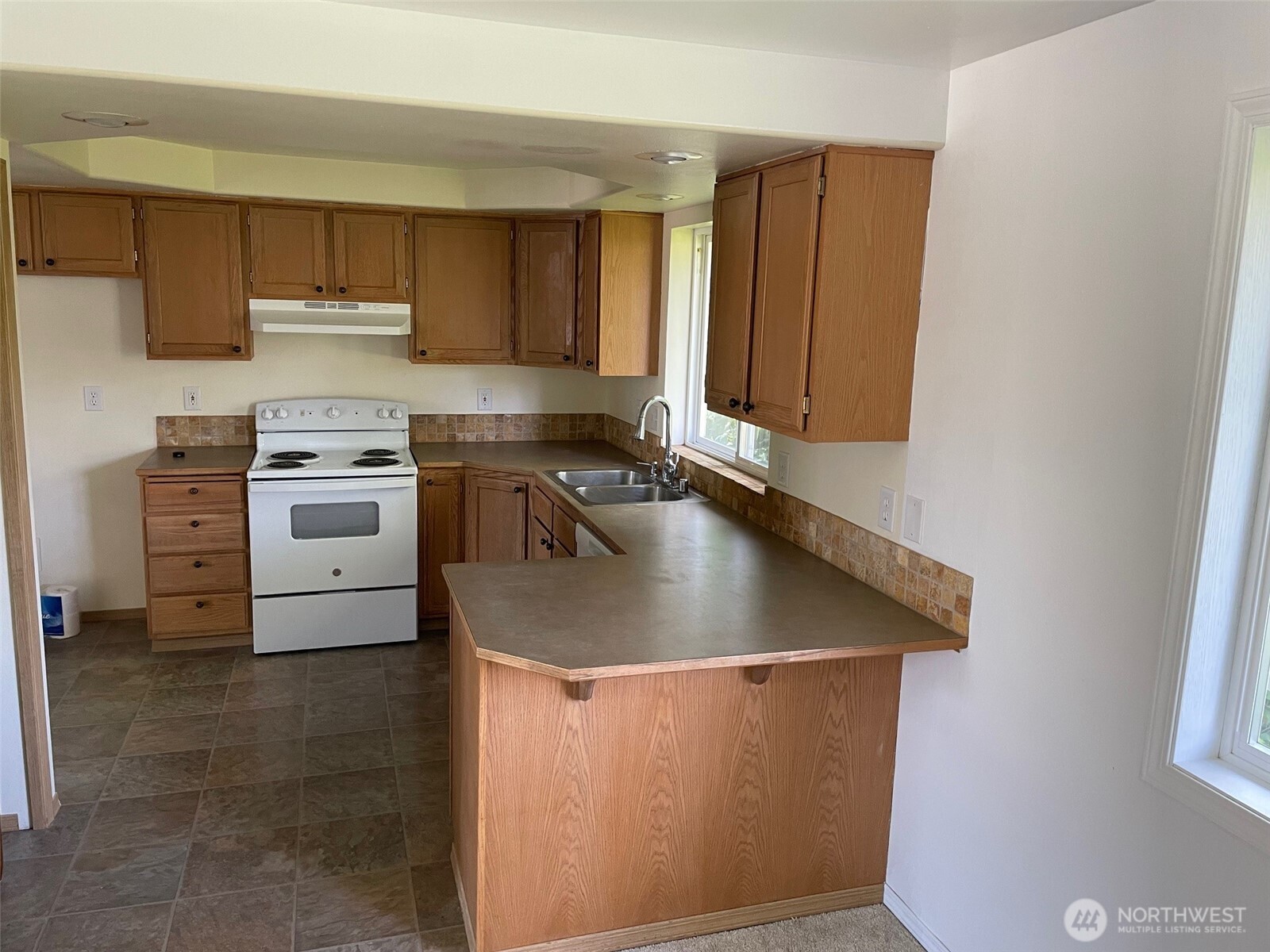 610 Rose Way Everett, WA 98203 - Photo 21 of 21 a kitchen with appliances cabinets and a sink