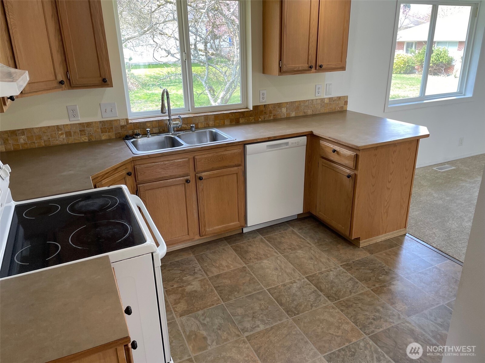 610 Rose Way Everett, WA 98203 - Photo 5 of 21 a kitchen with sink cabinets and window