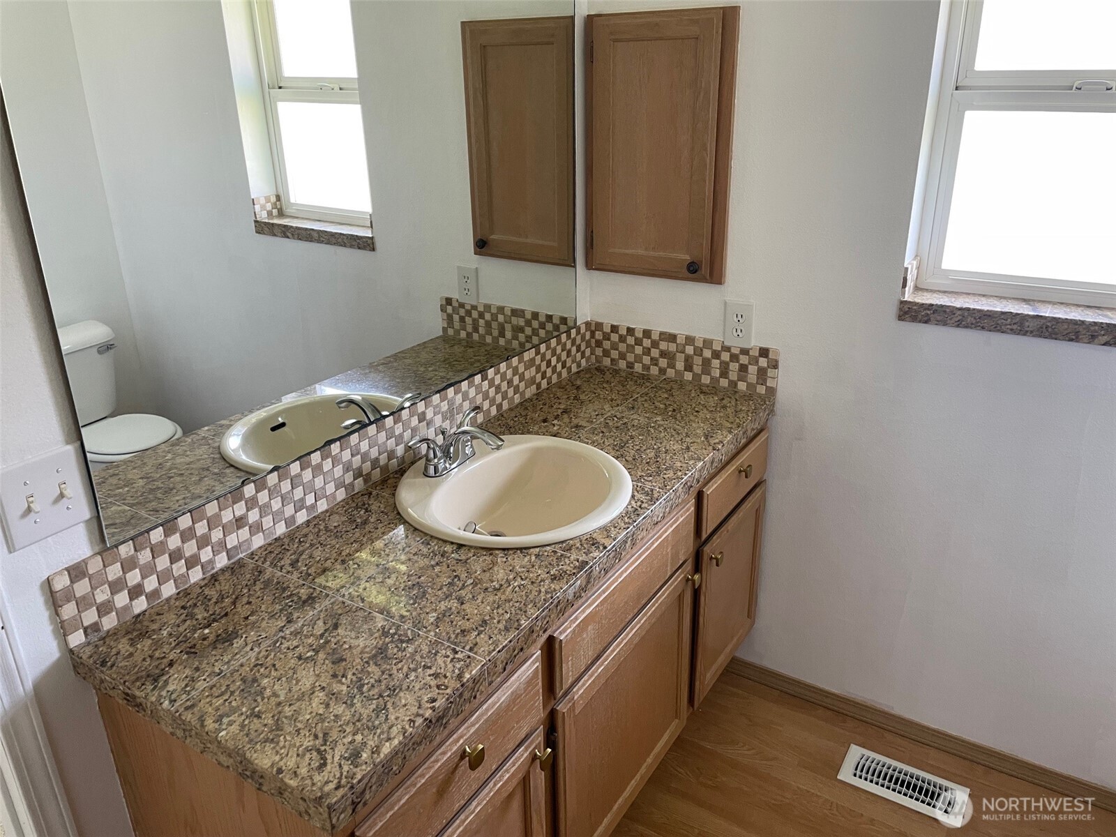 610 Rose Way Everett, WA 98203 - Photo 7 of 21 a bathroom with a granite countertop sink and a mirror