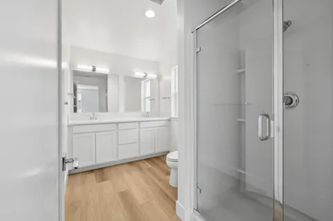 a bathroom with a shower and a sink
