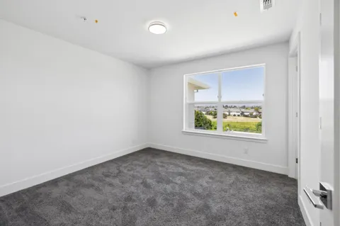 an empty room with windows and window