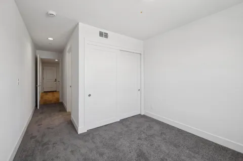 an empty room with a bathroom