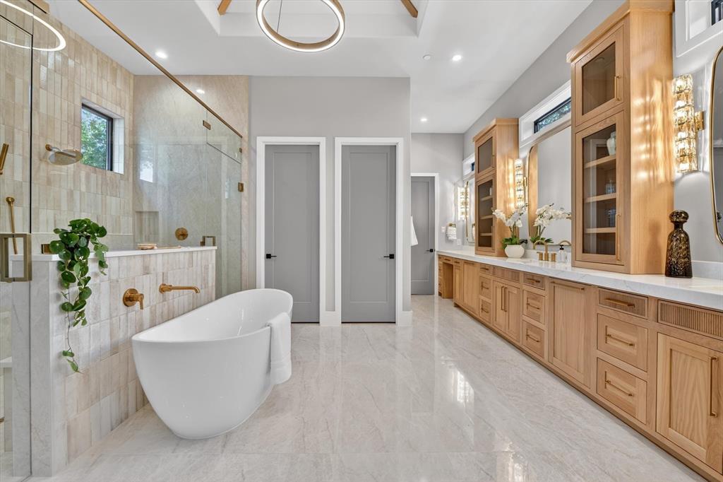 11028 Edgemere Road Dallas, TX 75230 - Photo 26 of 40 Freestanding soaking tub with gold-finish fixtures