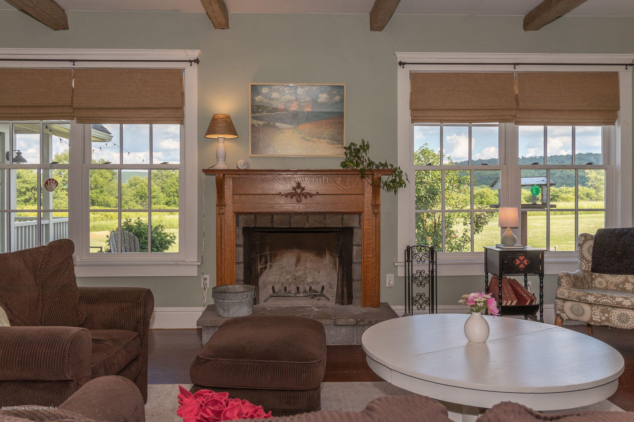 353 Freeman Road Dalton, PA 18414 - Photo 11 of 101 a living room with furniture and a fireplace
