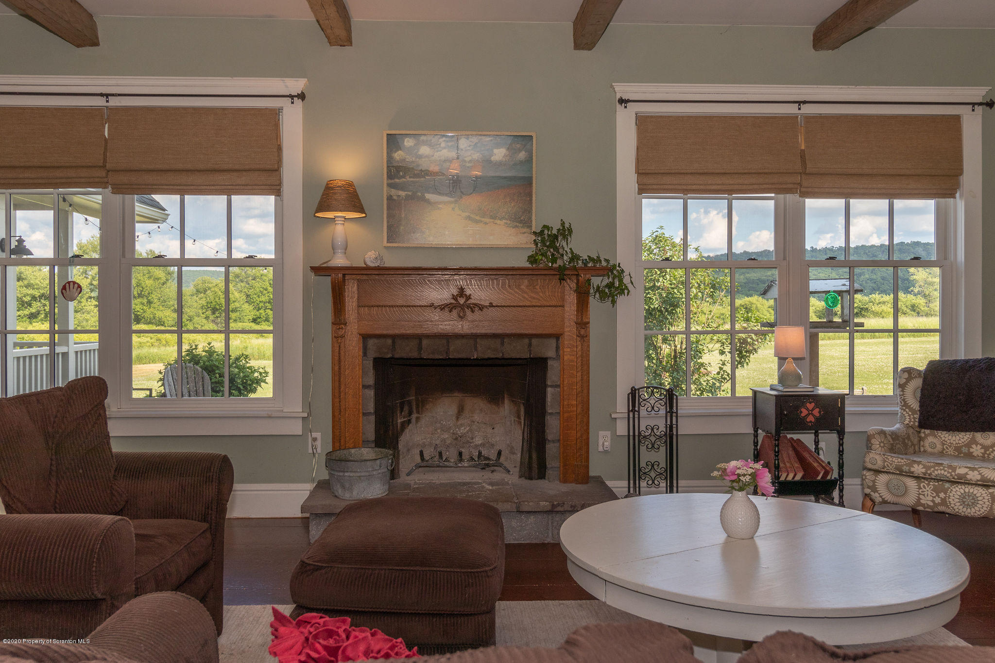 353 Freeman Road Dalton, PA 18414 - Photo 17 of 101 a living room with furniture and a fireplace