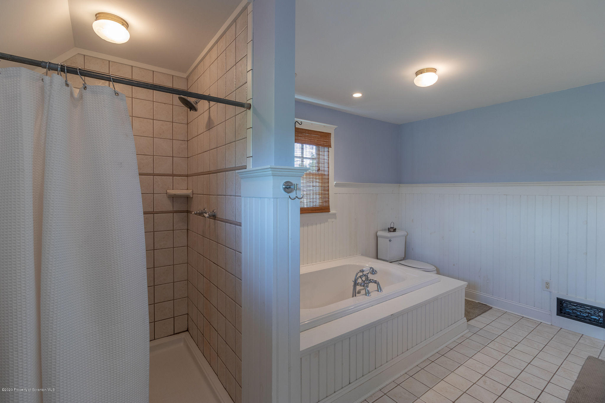 353 Freeman Road Dalton, PA 18414 - Photo 24 of 101 a bathroom with a bathtub and shower