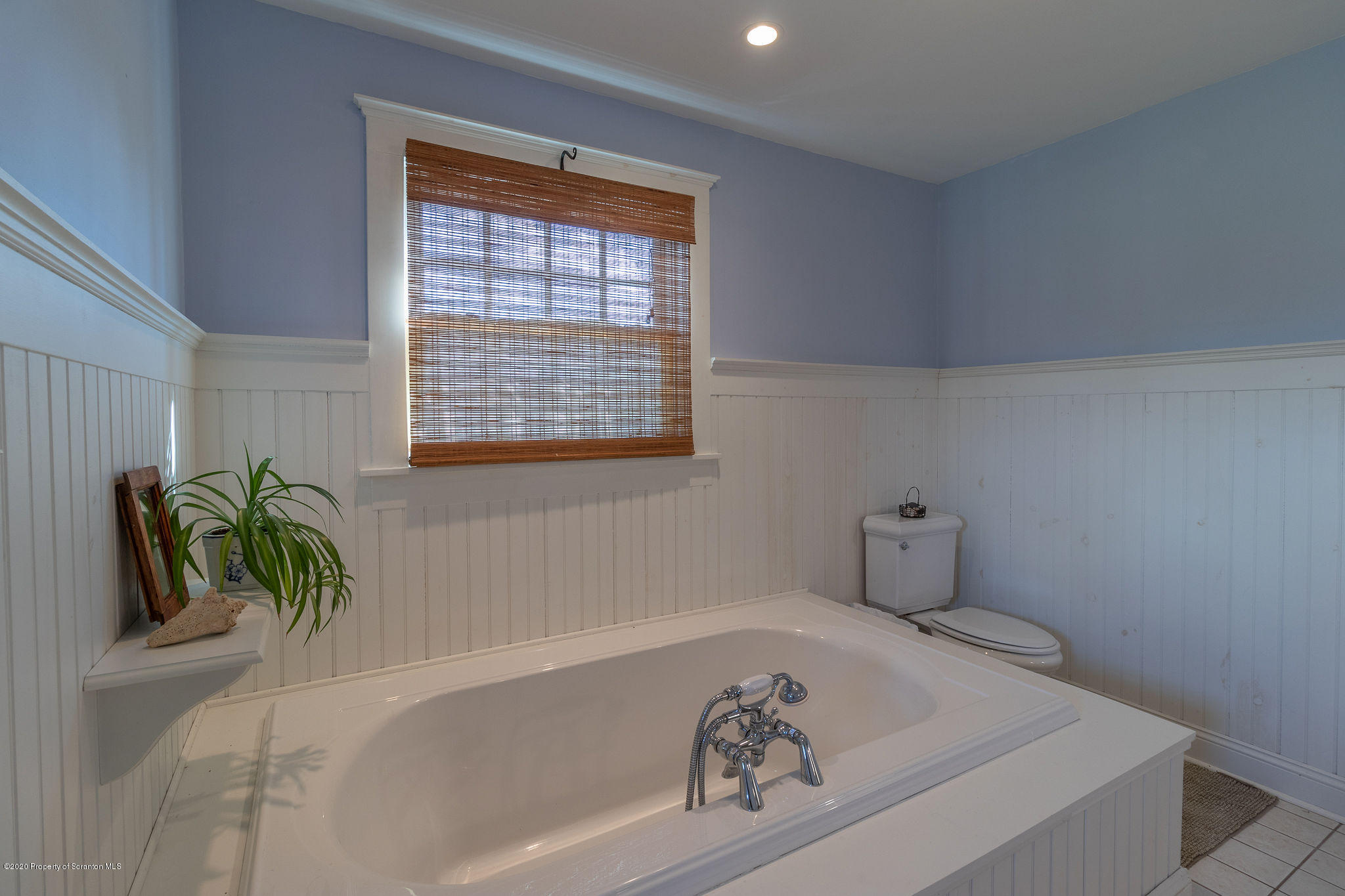 353 Freeman Road Dalton, PA 18414 - Photo 25 of 101 a bath tub sitting in a bathroom next to a window