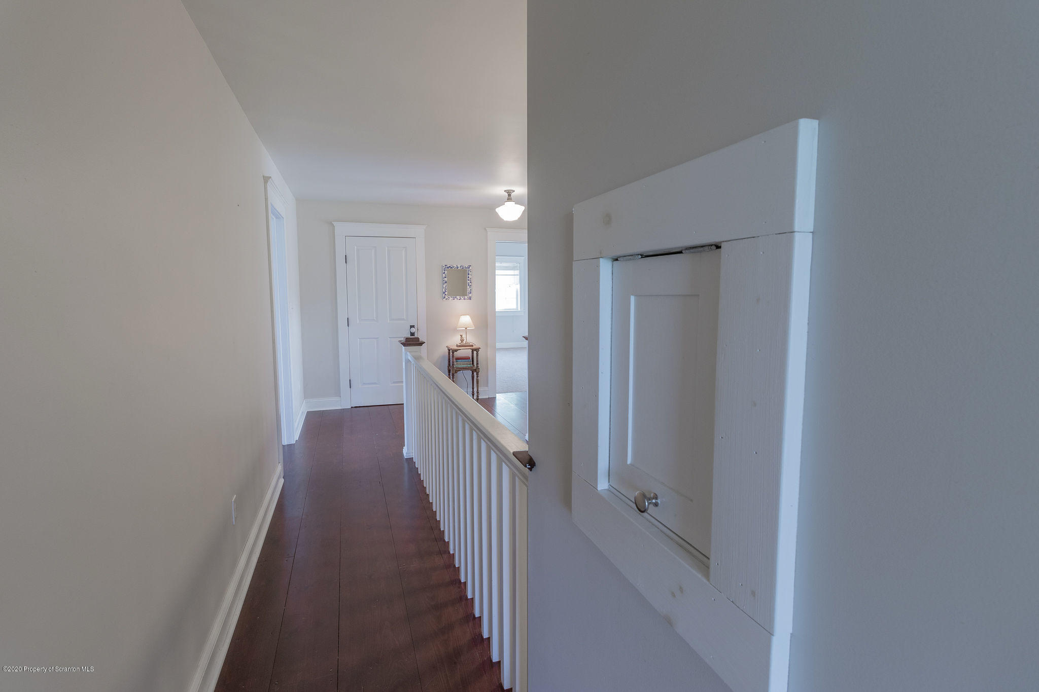 353 Freeman Road Dalton, PA 18414 - Photo 48 of 101 a view of a hallway with wooden floor and a bathroom