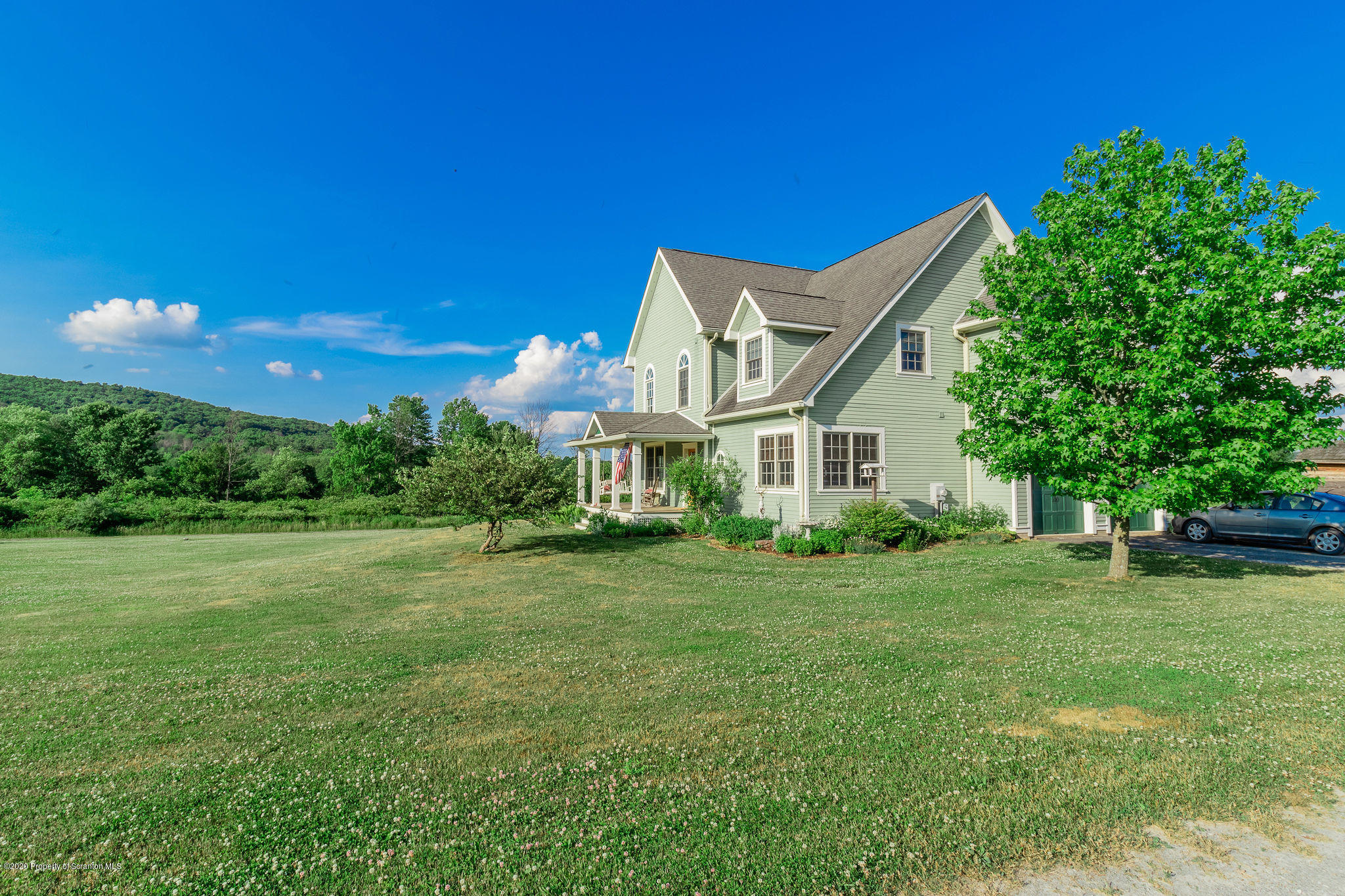 353 Freeman Road Dalton, PA 18414 - Photo 77 of 101 a front view of a house with a yard