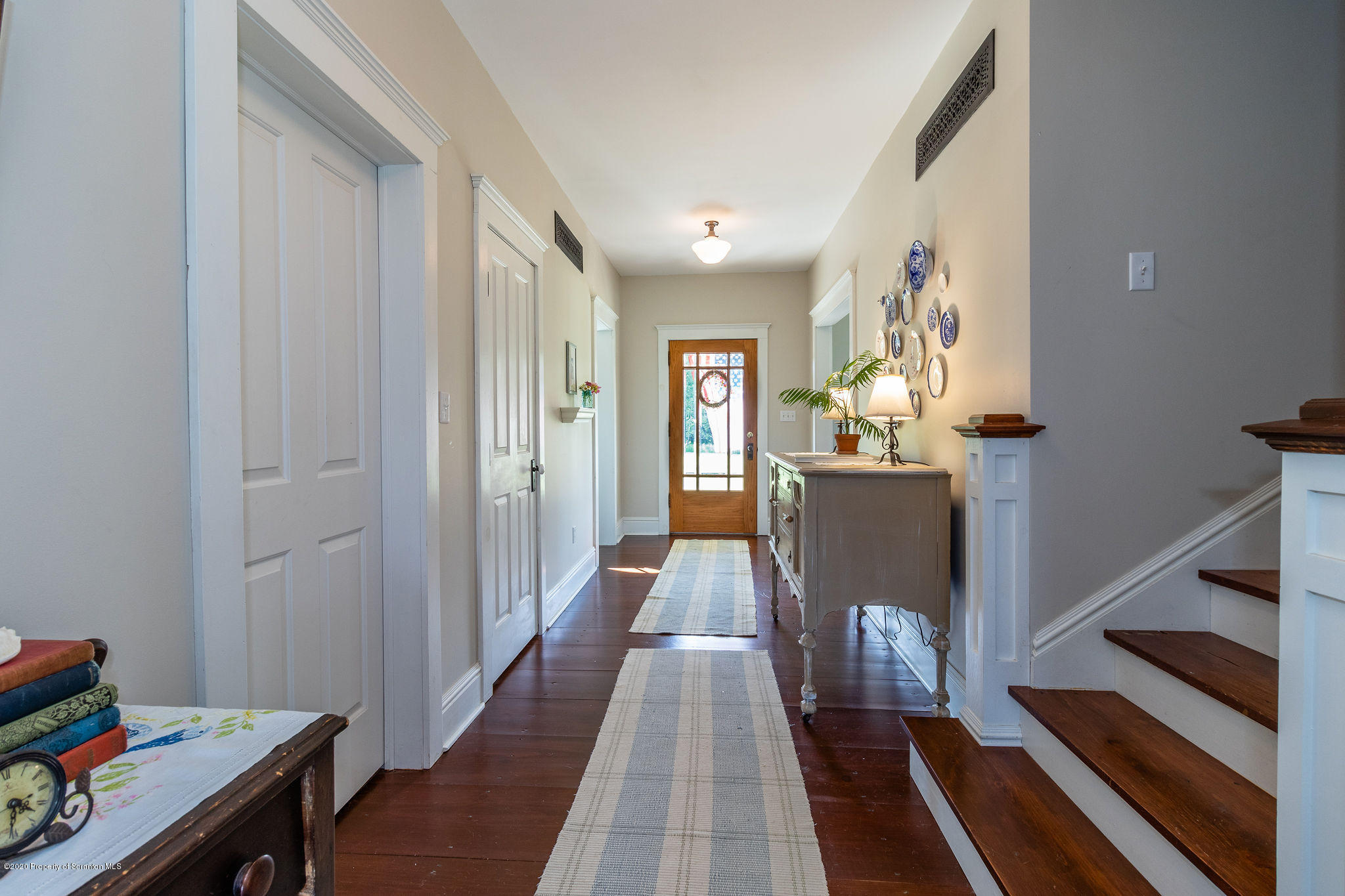 353 Freeman Road Dalton, PA 18414 - Photo 10 of 101 a view of a hallway with furniture and wooden floor