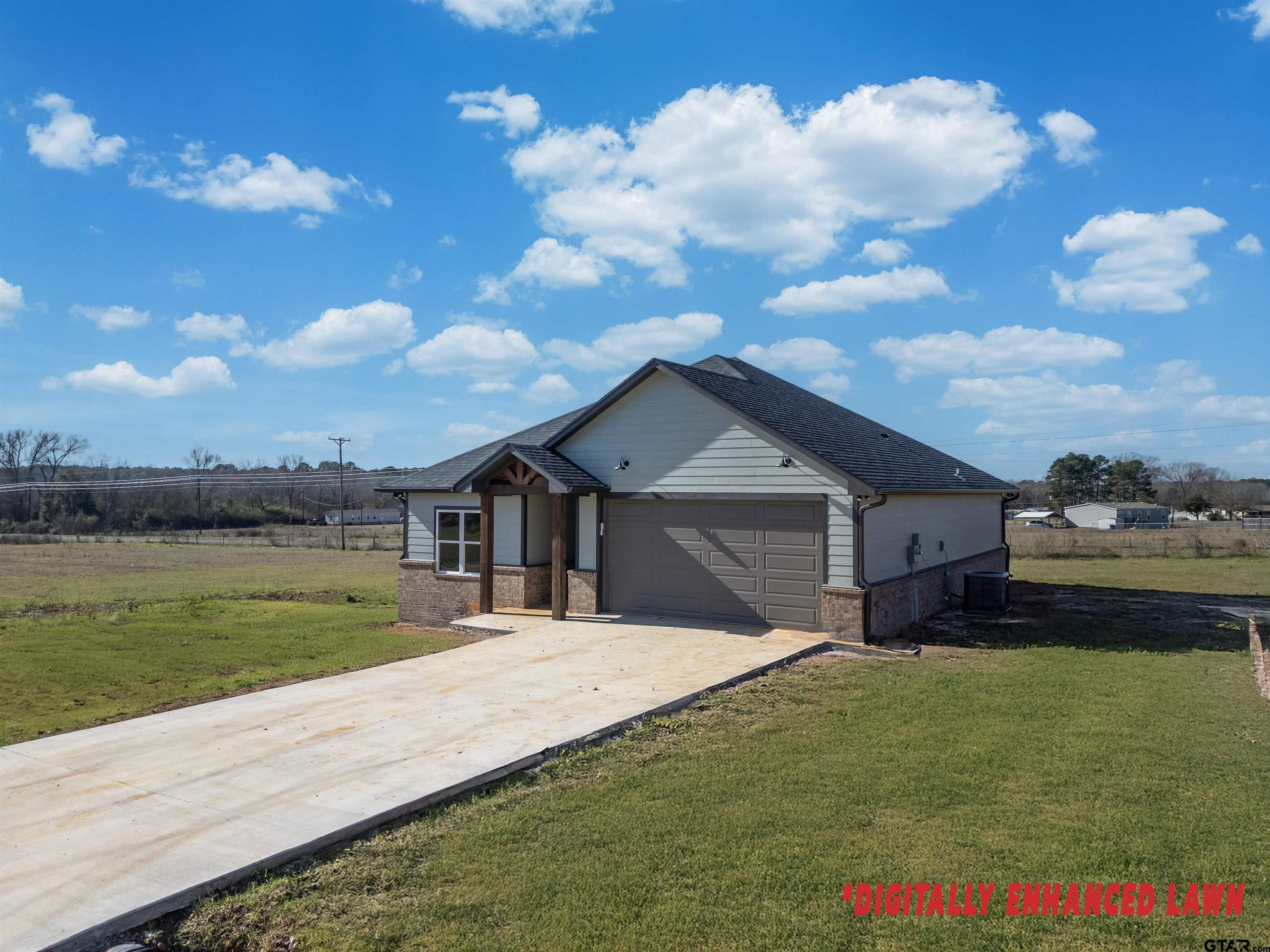 148 Crescent Bullard, TX 75757 - Photo 2 of 40 a front view of a house with a yard