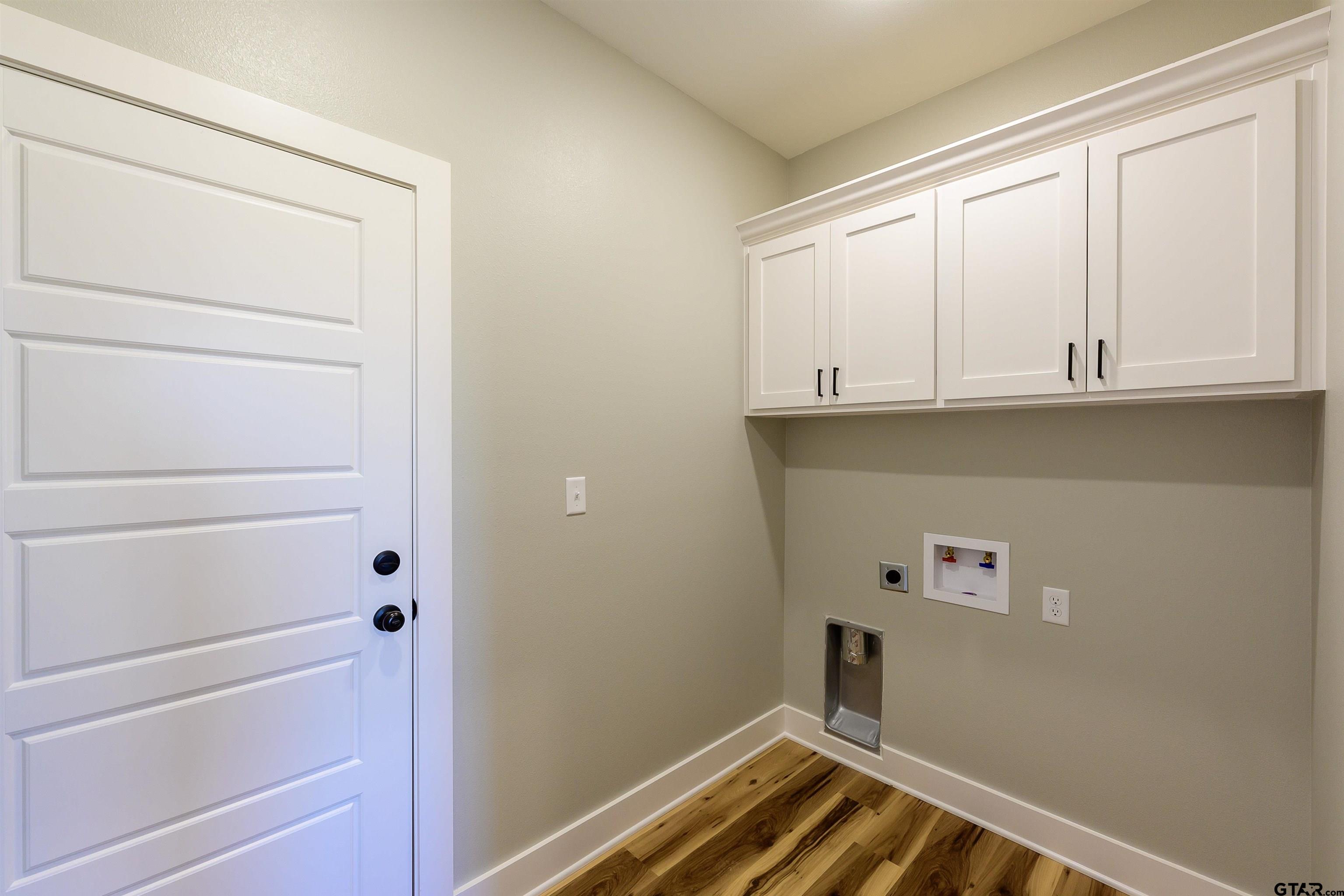 148 Crescent Bullard, TX 75757 - Photo 27 of 40 a bathroom with a sink and cabinets