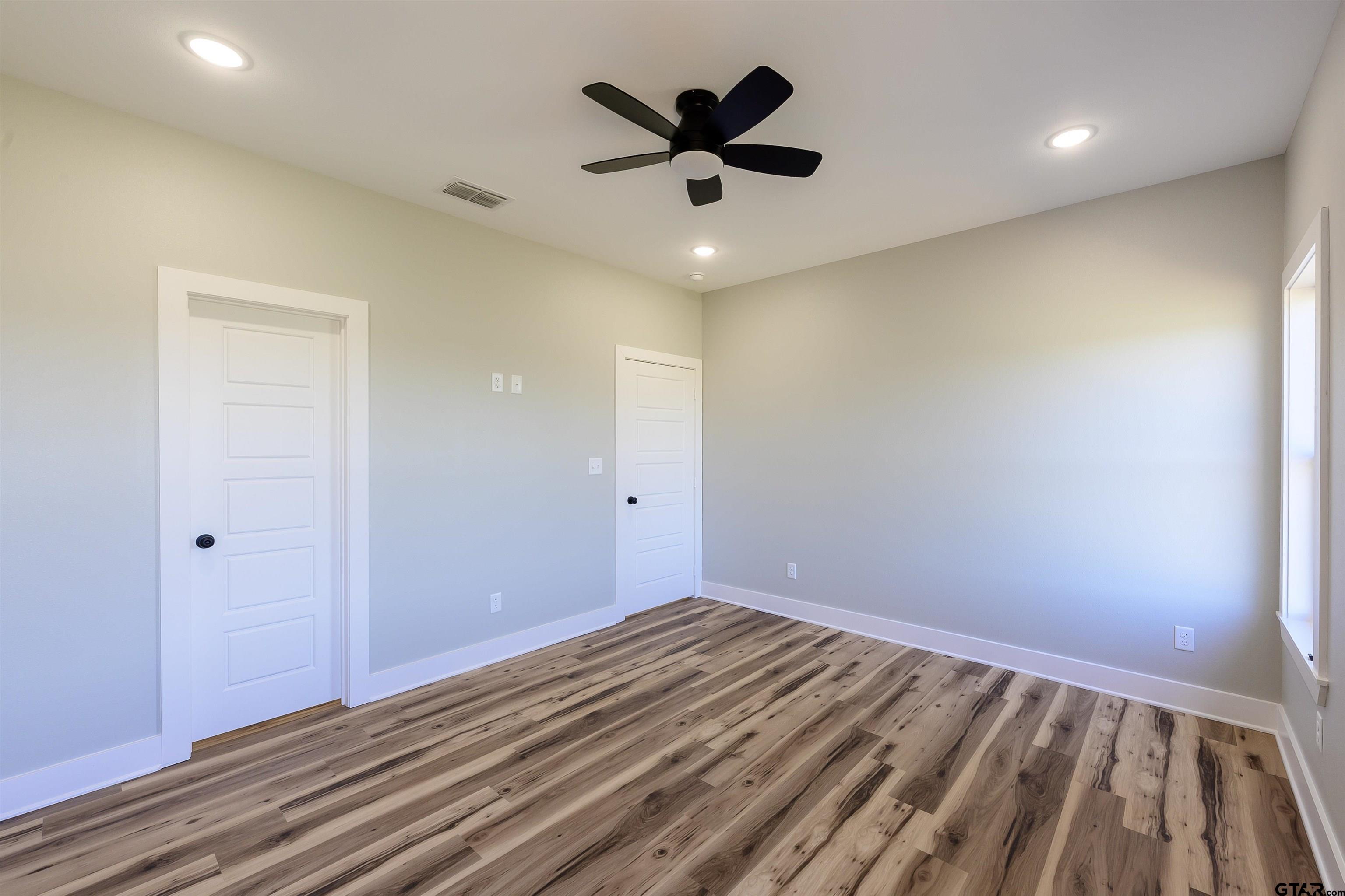148 Crescent Bullard, TX 75757 - Photo 30 of 40 wooden floor in an empty room