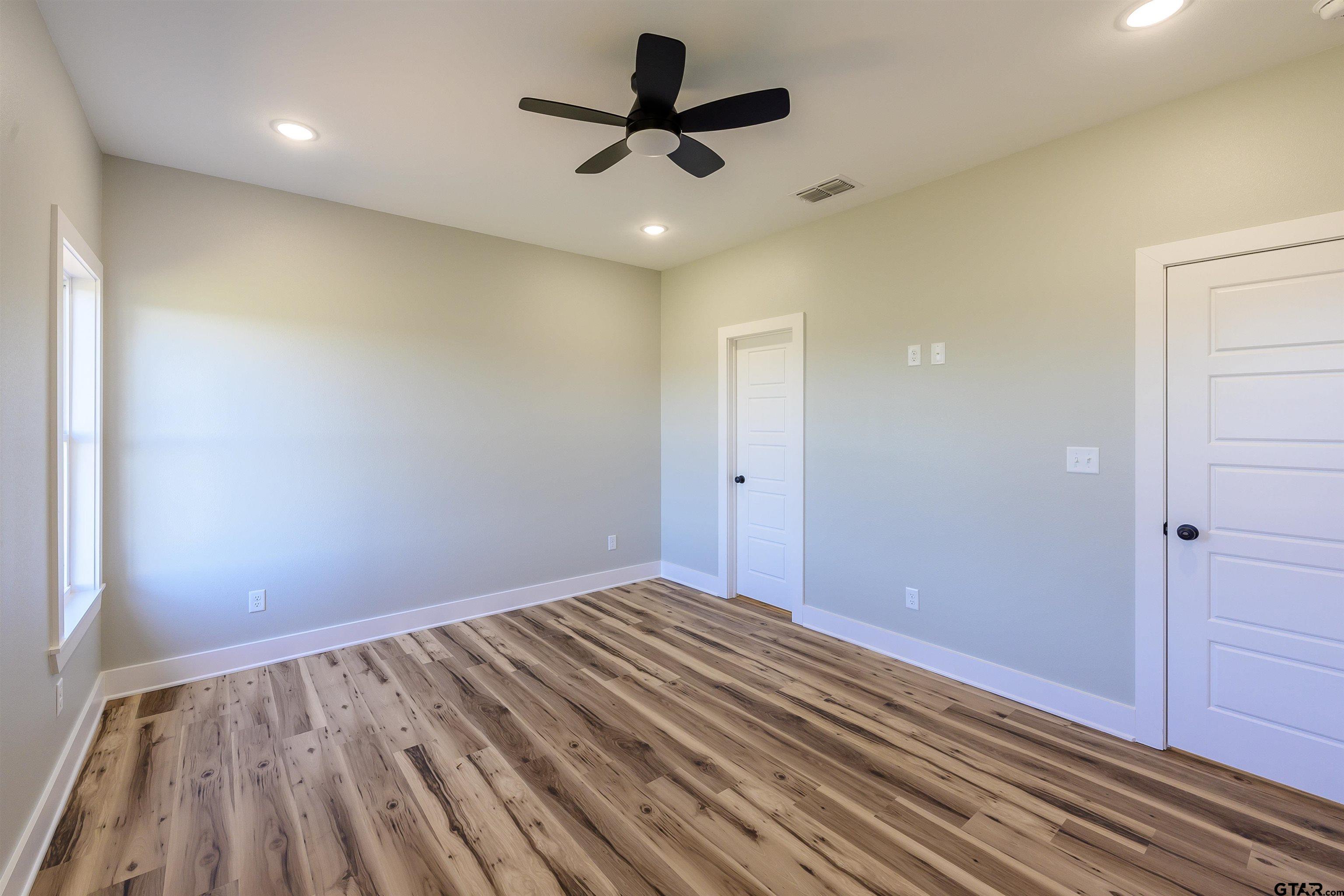 148 Crescent Bullard, TX 75757 - Photo 31 of 40 a view of an empty room and wooden floor