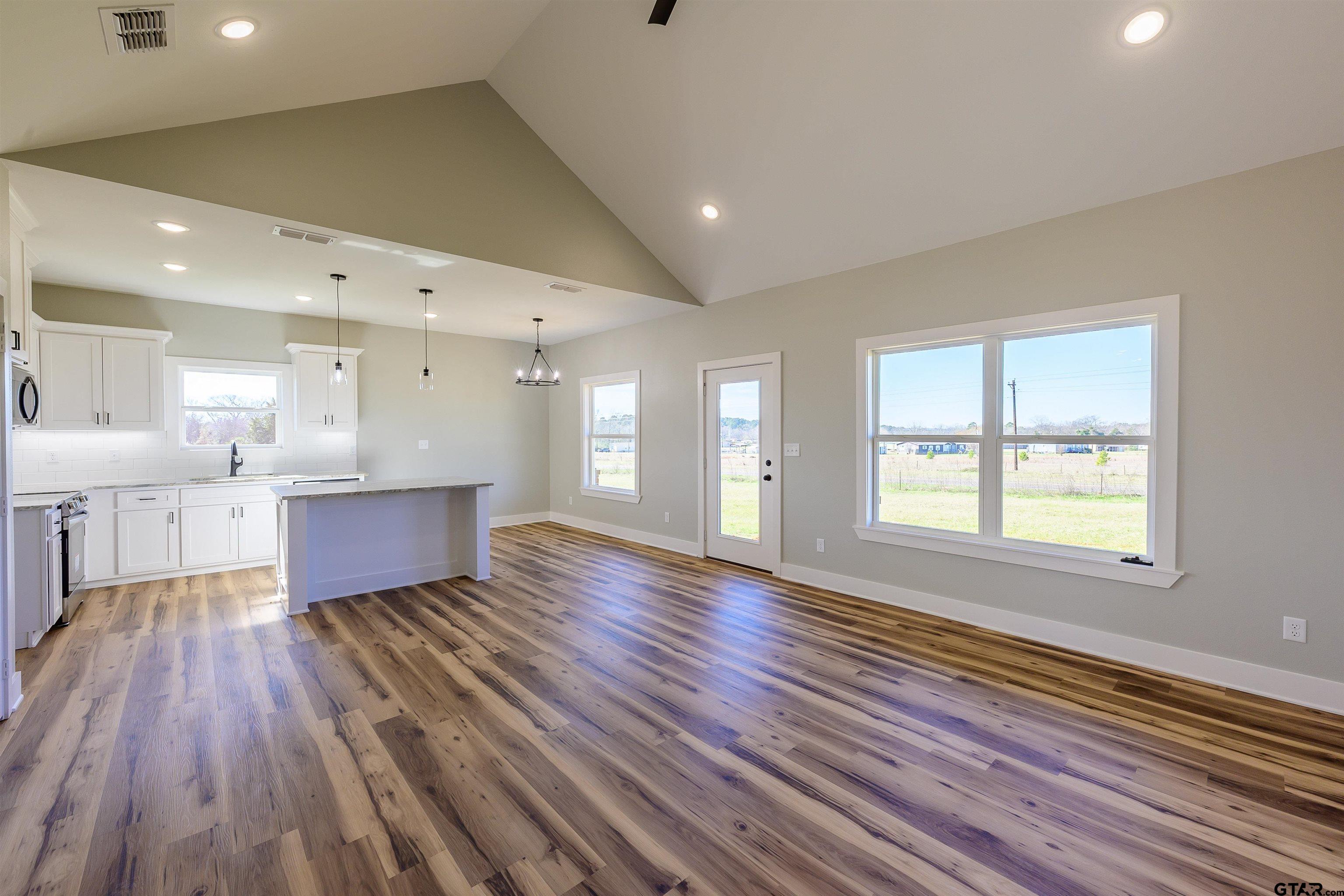 148 Crescent Bullard, TX 75757 - Photo 6 of 40 a large space with lots of counter space and windows