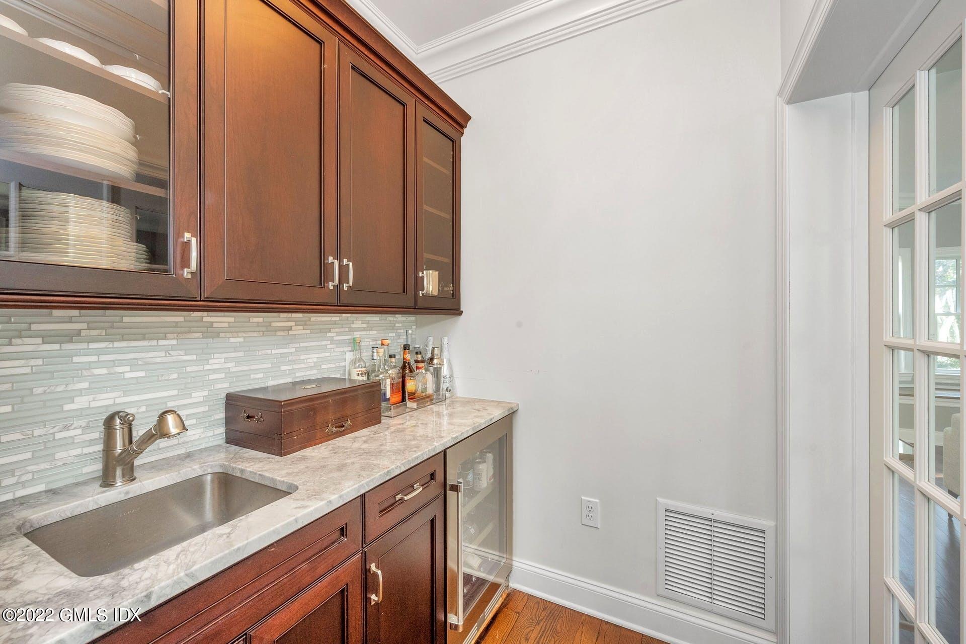 10 Boyd Lane Riverside, CT 06878 - Photo 11 of 30 a view kitchen with granite countertop a sink dishwasher stove and cabinets with wooden floor