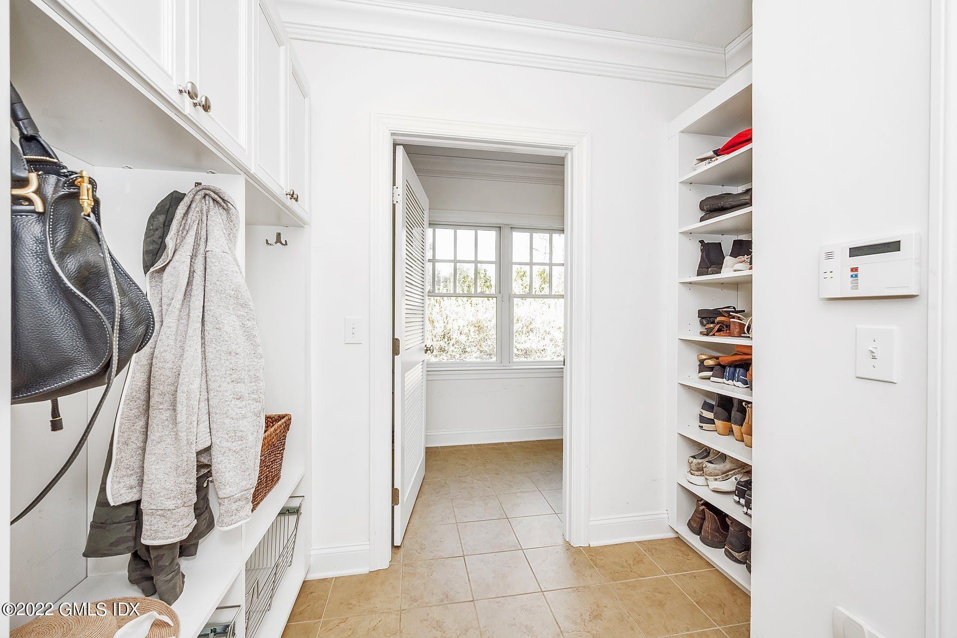 10 Boyd Lane Riverside, CT 06878 - Photo 14 of 30 a view of walk in closet with clothes and shoes