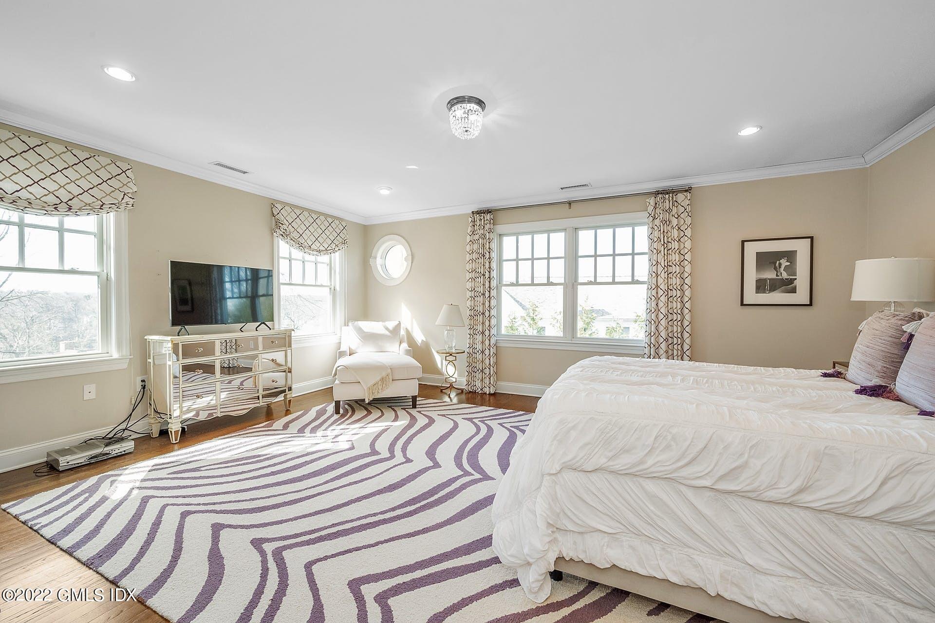 10 Boyd Lane Riverside, CT 06878 - Photo 15 of 30 a bedroom with a bed and a flat screen tv