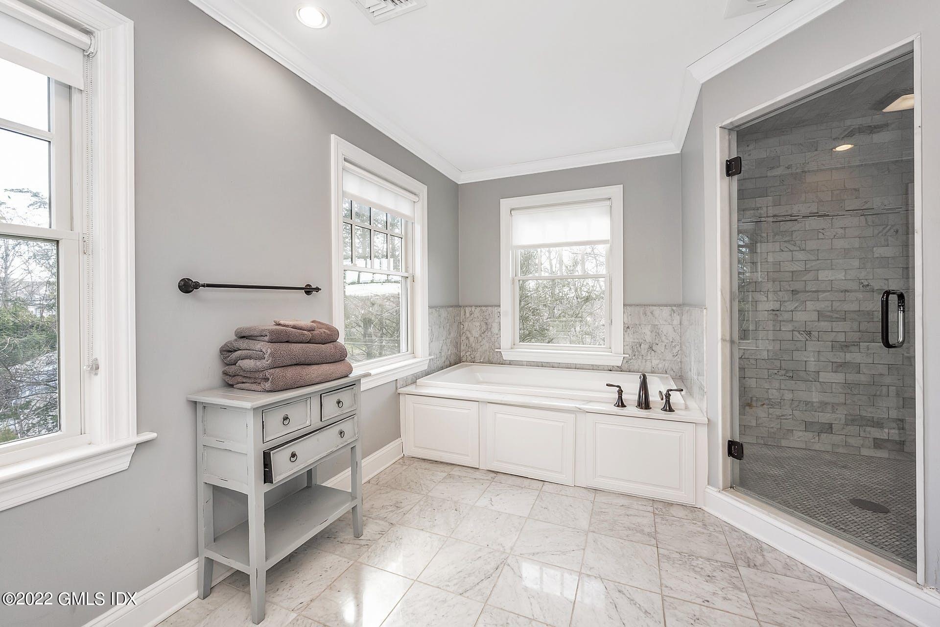 10 Boyd Lane Riverside, CT 06878 - Photo 17 of 30 a spacious bathroom with sink shower bathtub and window