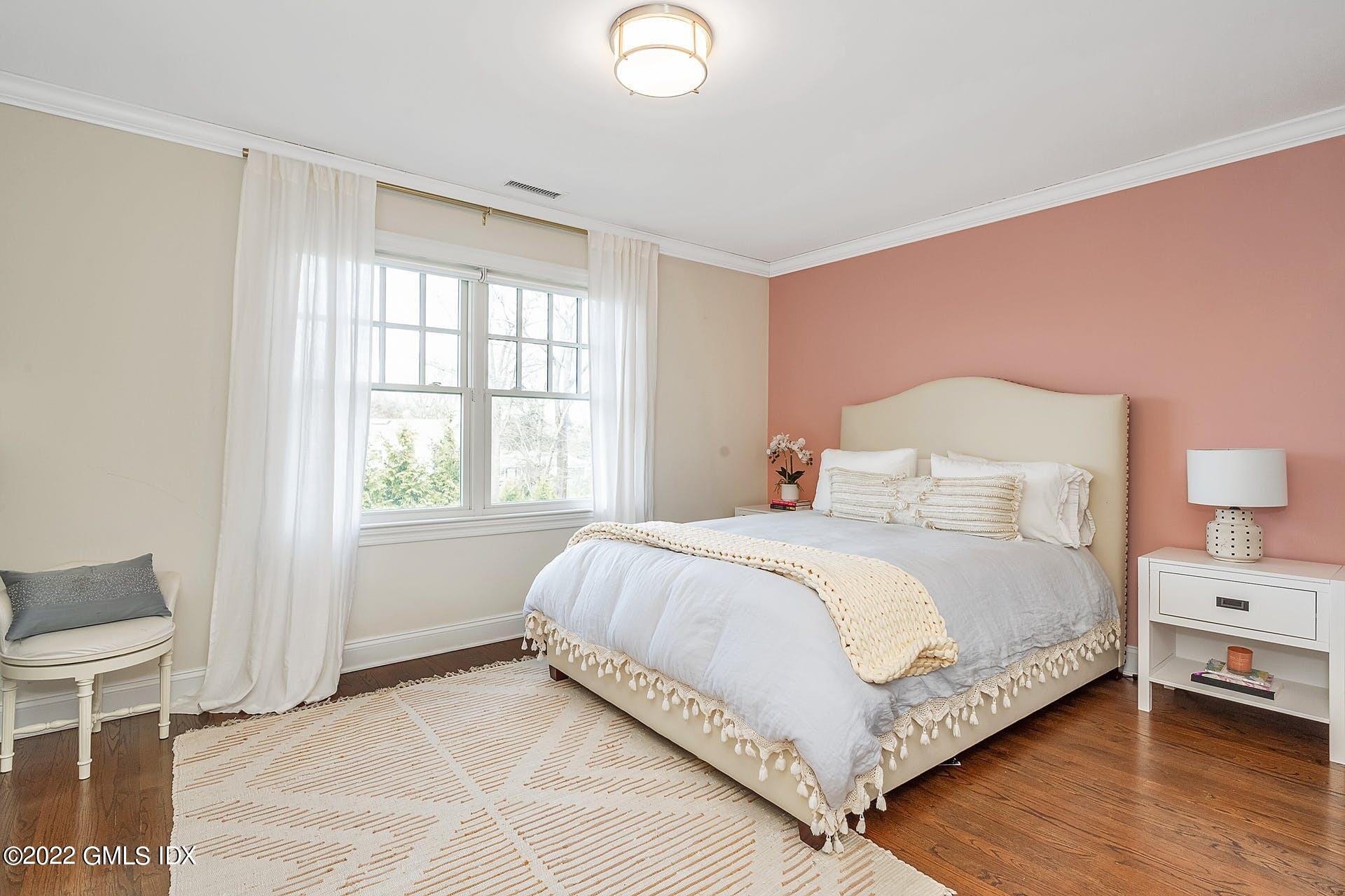 10 Boyd Lane Riverside, CT 06878 - Photo 19 of 30 a bedroom with a bed and a window