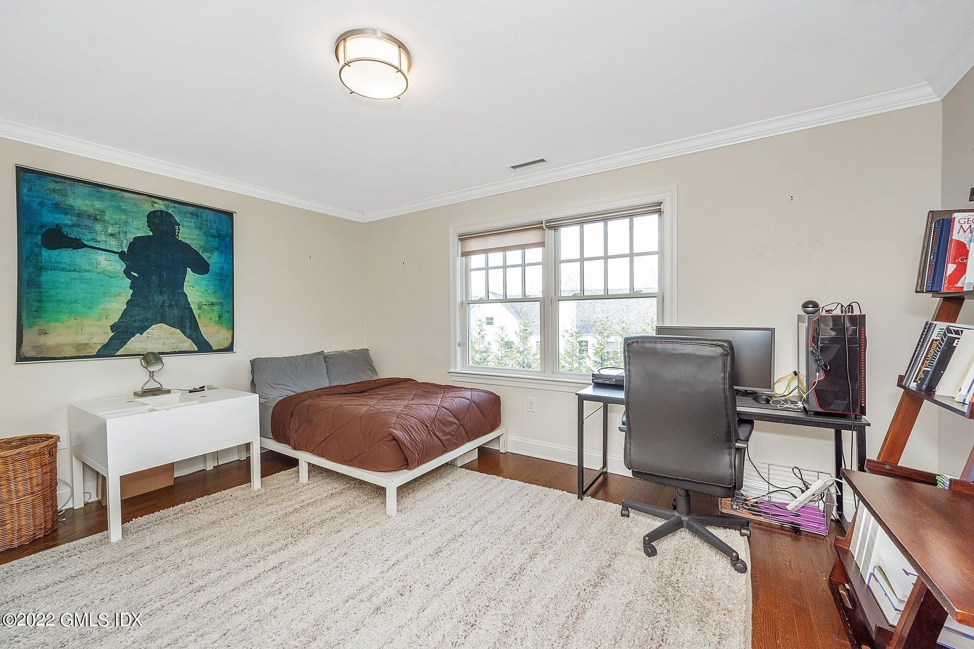 10 Boyd Lane Riverside, CT 06878 - Photo 20 of 30 a living room with furniture a flat screen tv and a window