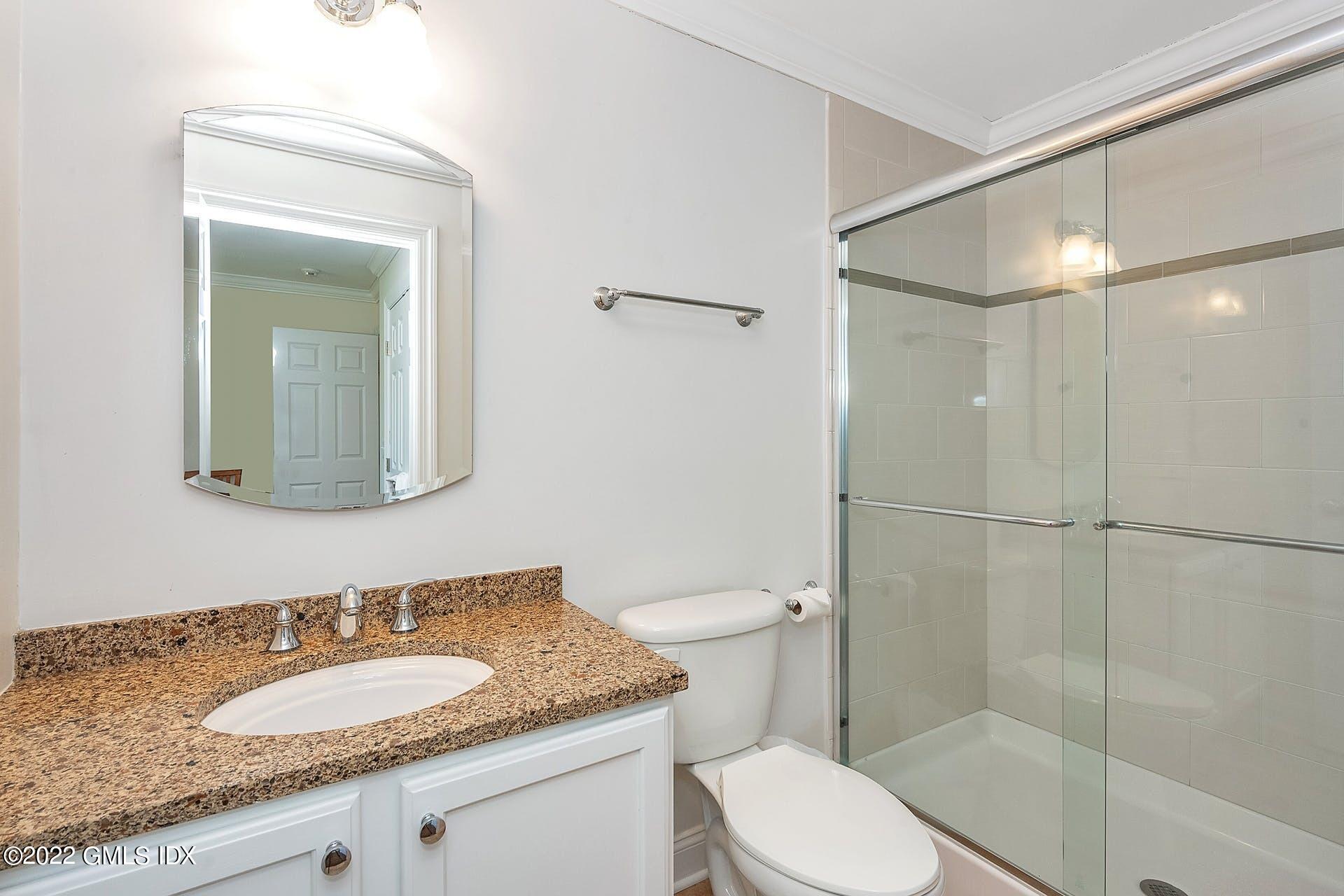 10 Boyd Lane Riverside, CT 06878 - Photo 22 of 30 a bathroom with a granite countertop sink toilet and shower