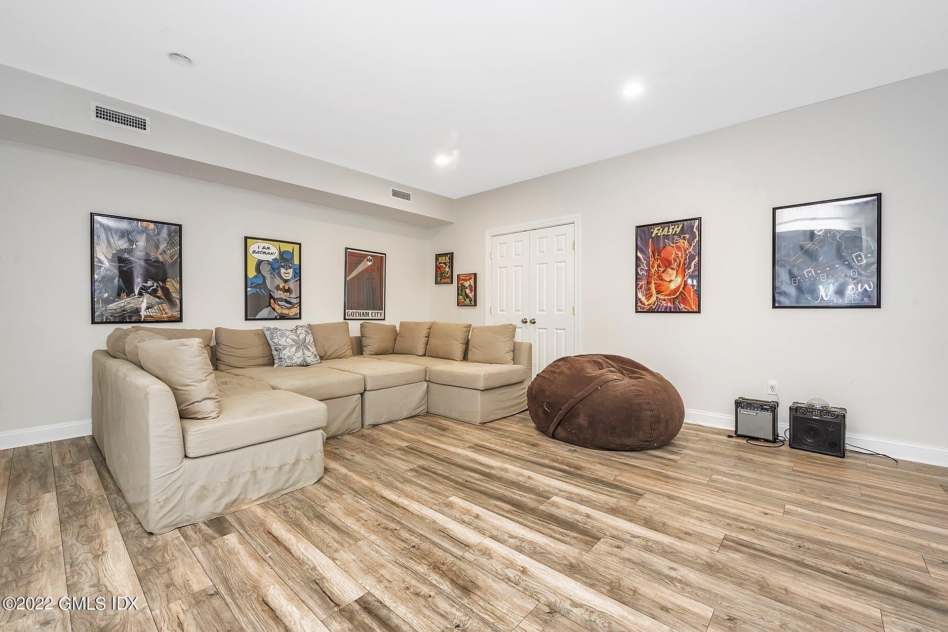 10 Boyd Lane Riverside, CT 06878 - Photo 23 of 30 a living room with furniture and a large window