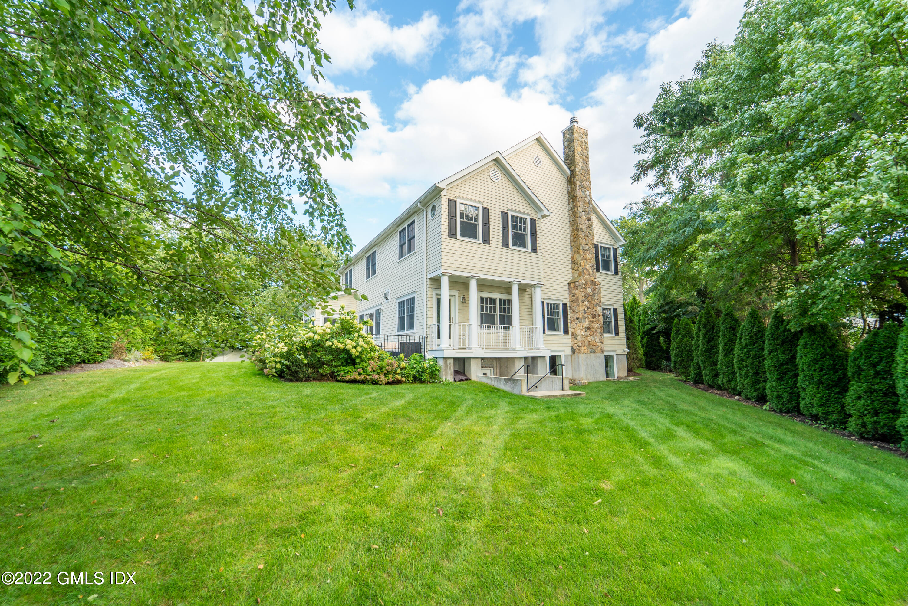 10 Boyd Lane Riverside, CT 06878 - Photo 30 of 30 a view of a house with a big yard with large trees