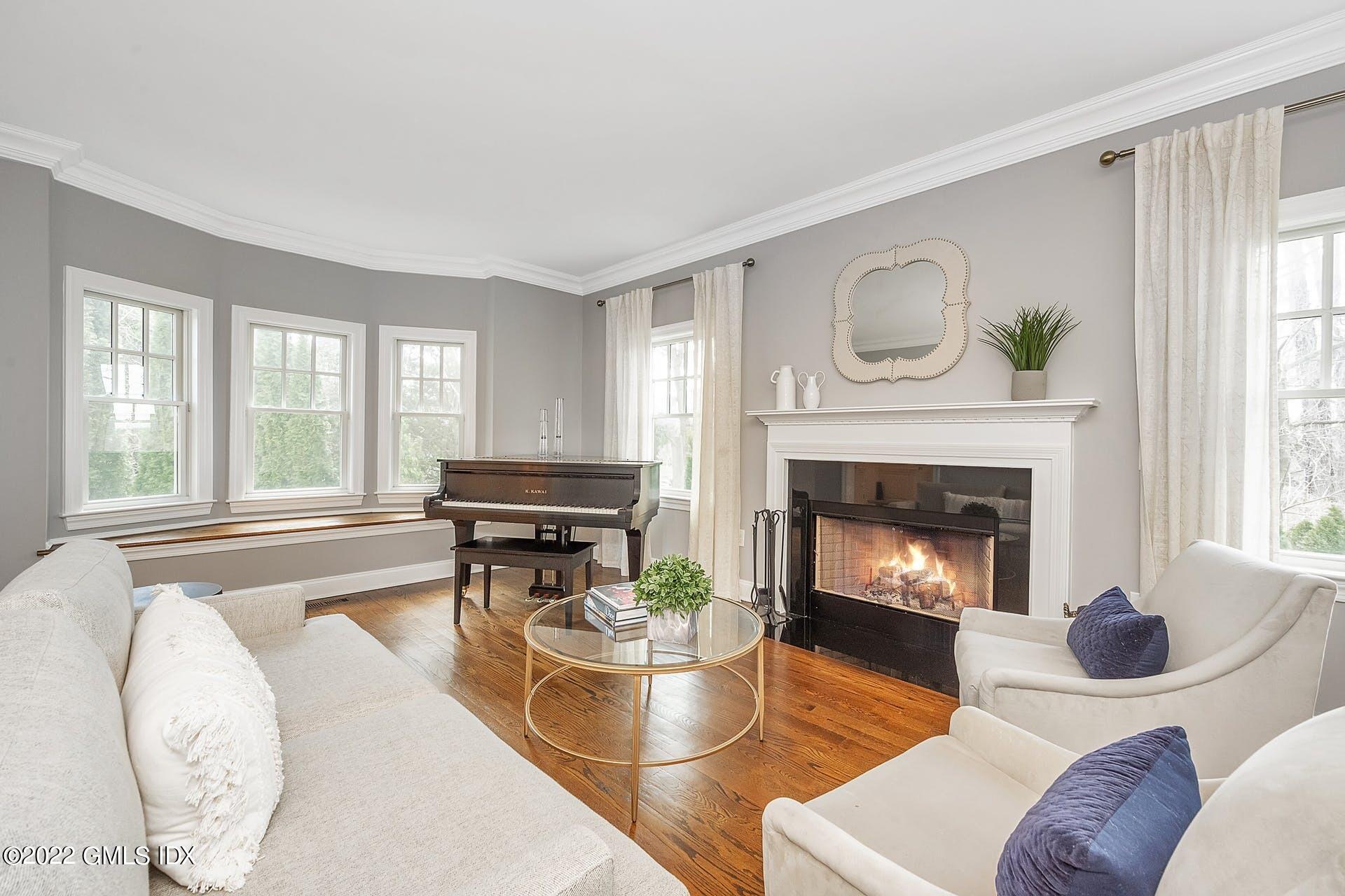 10 Boyd Lane Riverside, CT 06878 - Photo 3 of 30 a living room with furniture and a fireplace