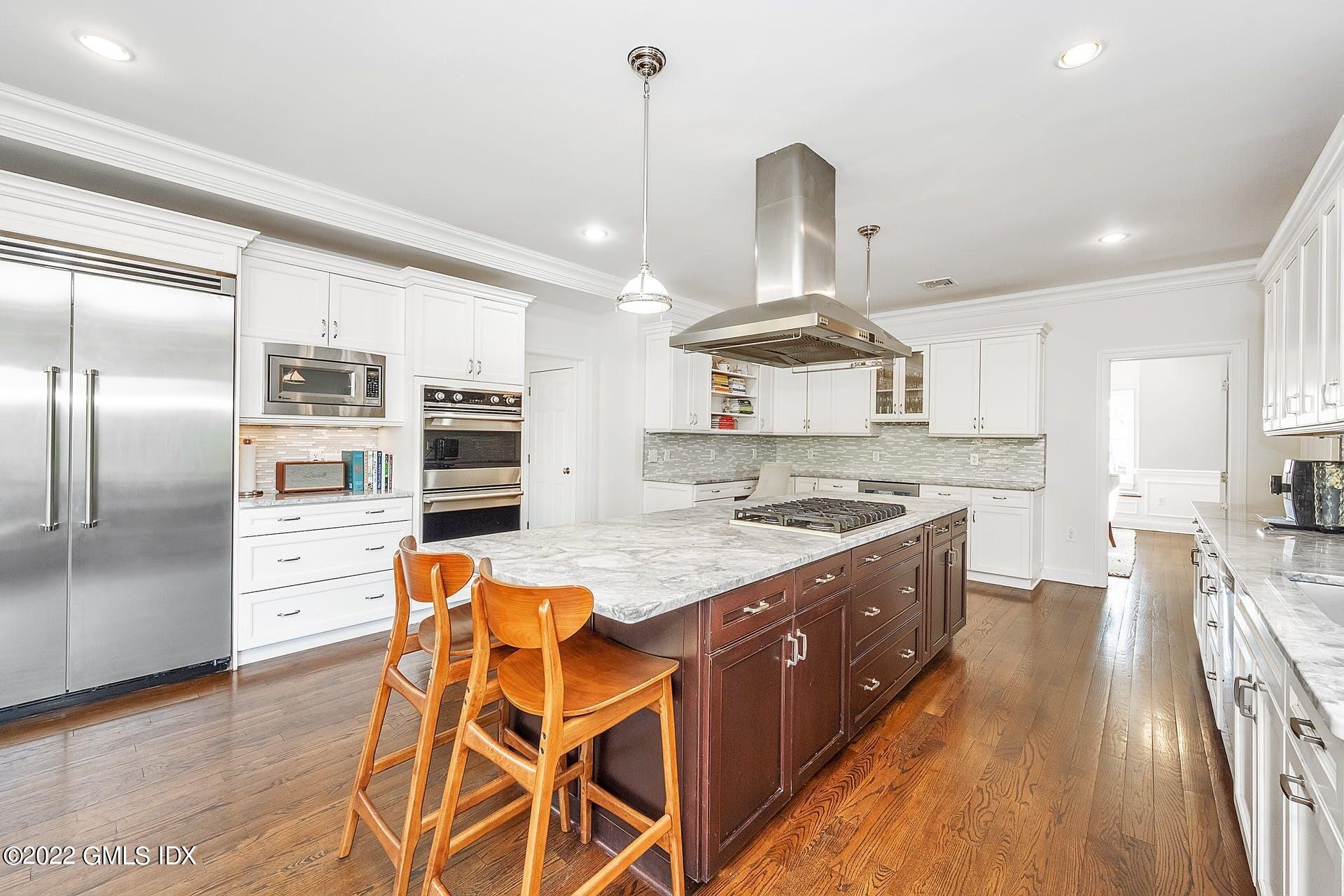 10 Boyd Lane Riverside, CT 06878 - Photo 6 of 30 a kitchen with stainless steel appliances a stove a sink and a refrigerator