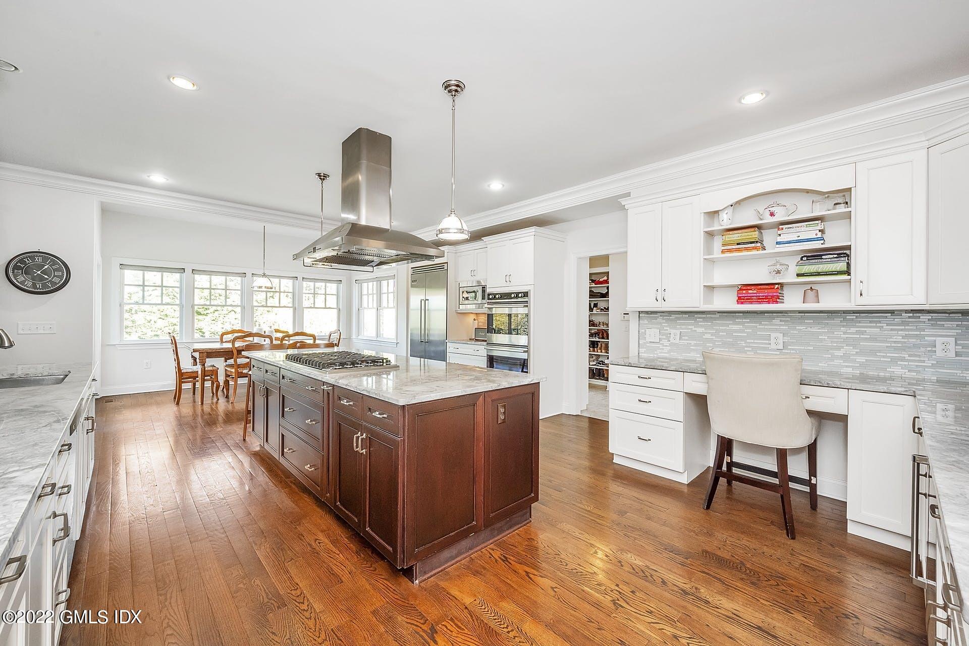10 Boyd Lane Riverside, CT 06878 - Photo 8 of 30 a living room with stainless steel appliances granite countertop furniture wooden floor and a large window