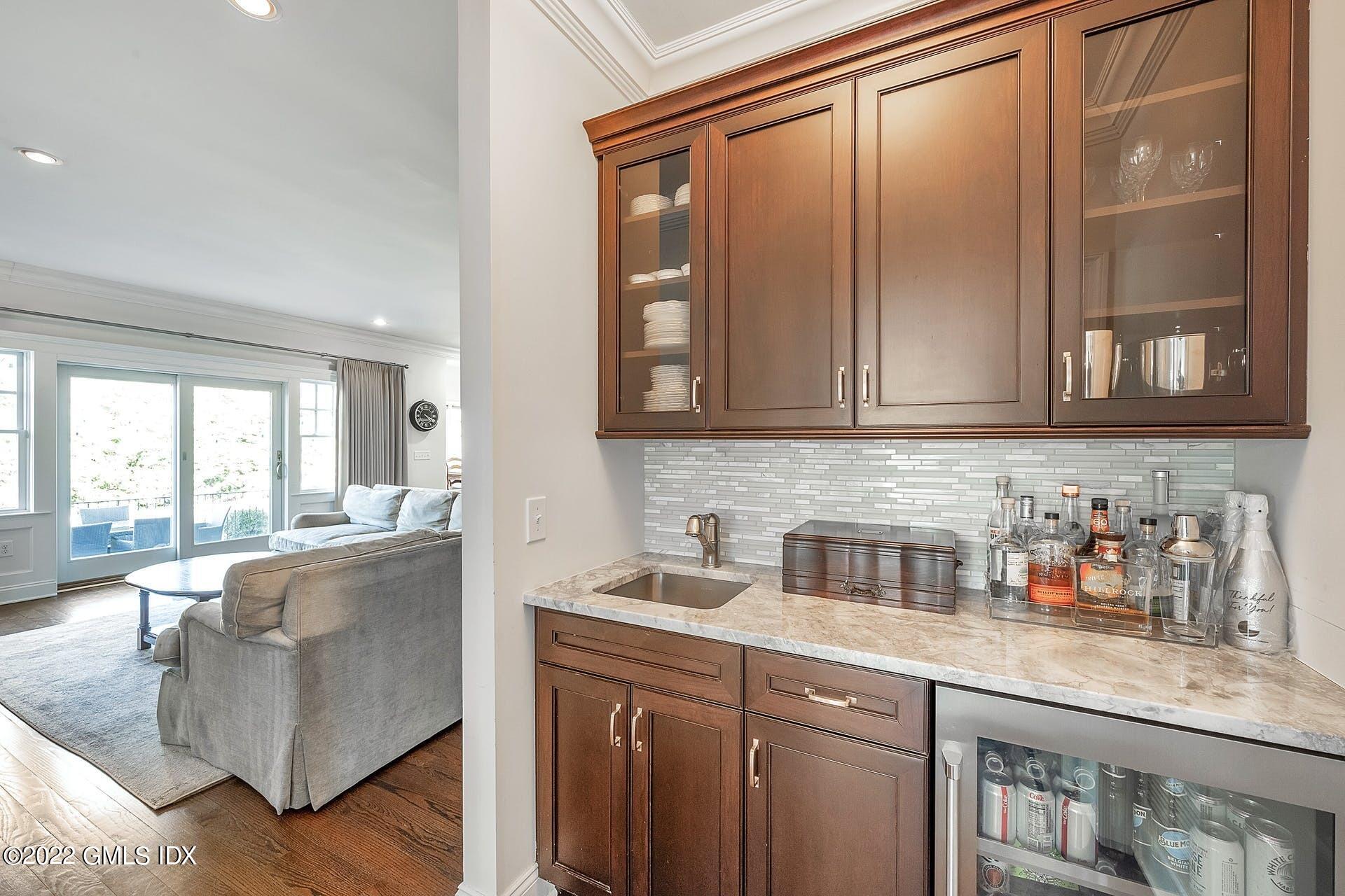 10 Boyd Lane Riverside, CT 06878 - Photo 10 of 30 a kitchen with stainless steel appliances granite countertop a sink and cabinets with wooden floor